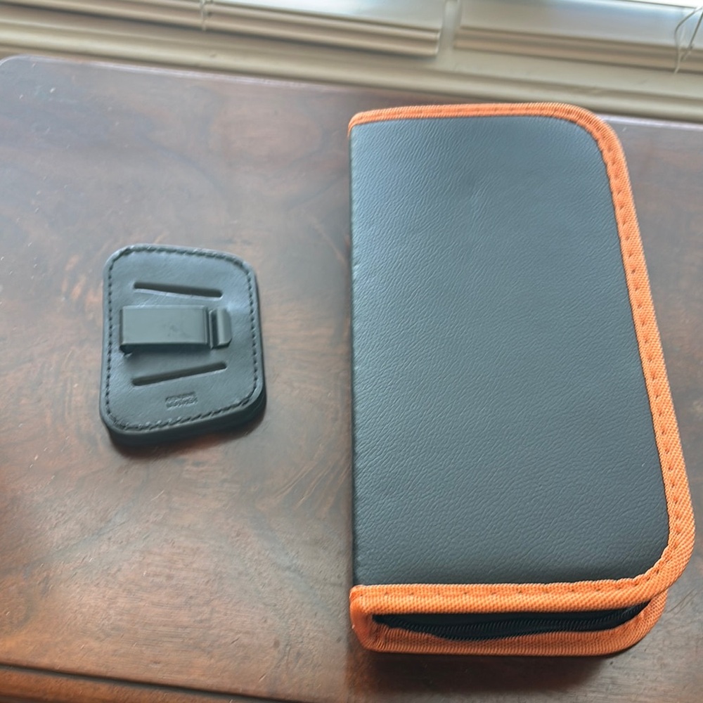 Black and Orange Gun Carrying Case and Holster.